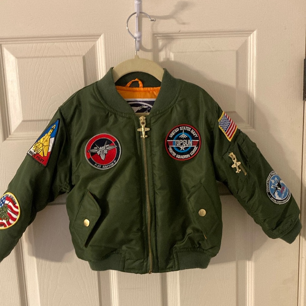 Green and Red Puffer Jacket with Vibrant Patches
